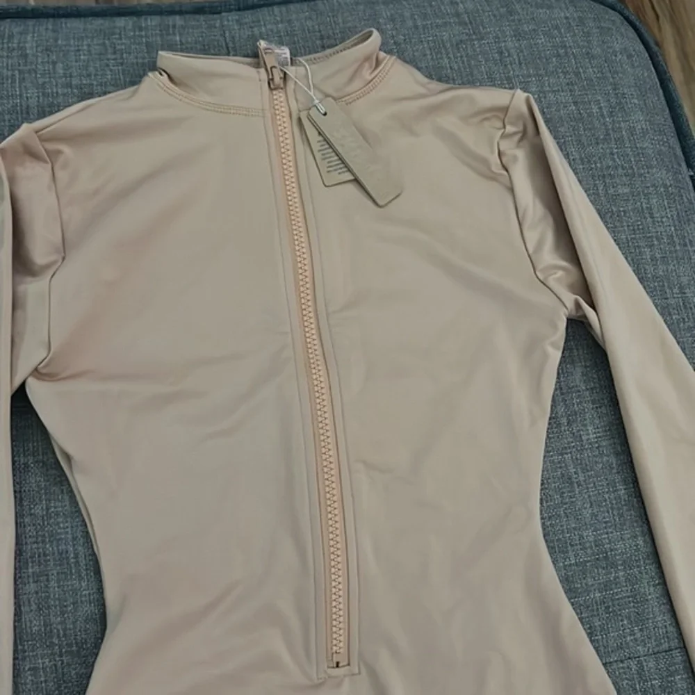 Skims Swim Zip Front Sleeve One Piece